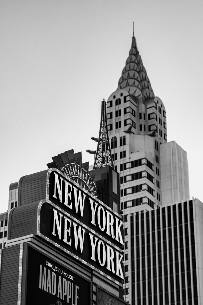 Monochrome view of iconic New York New York sign in Las Vegas, featuring recognizable architecture.